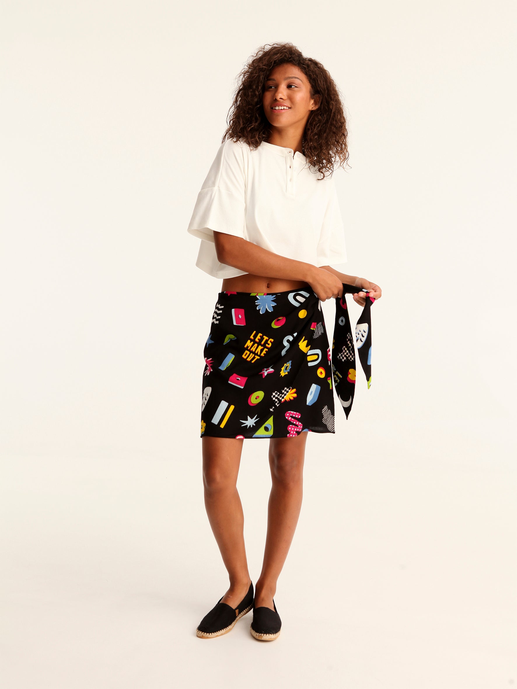 MORE AMOR mini wrap skirt