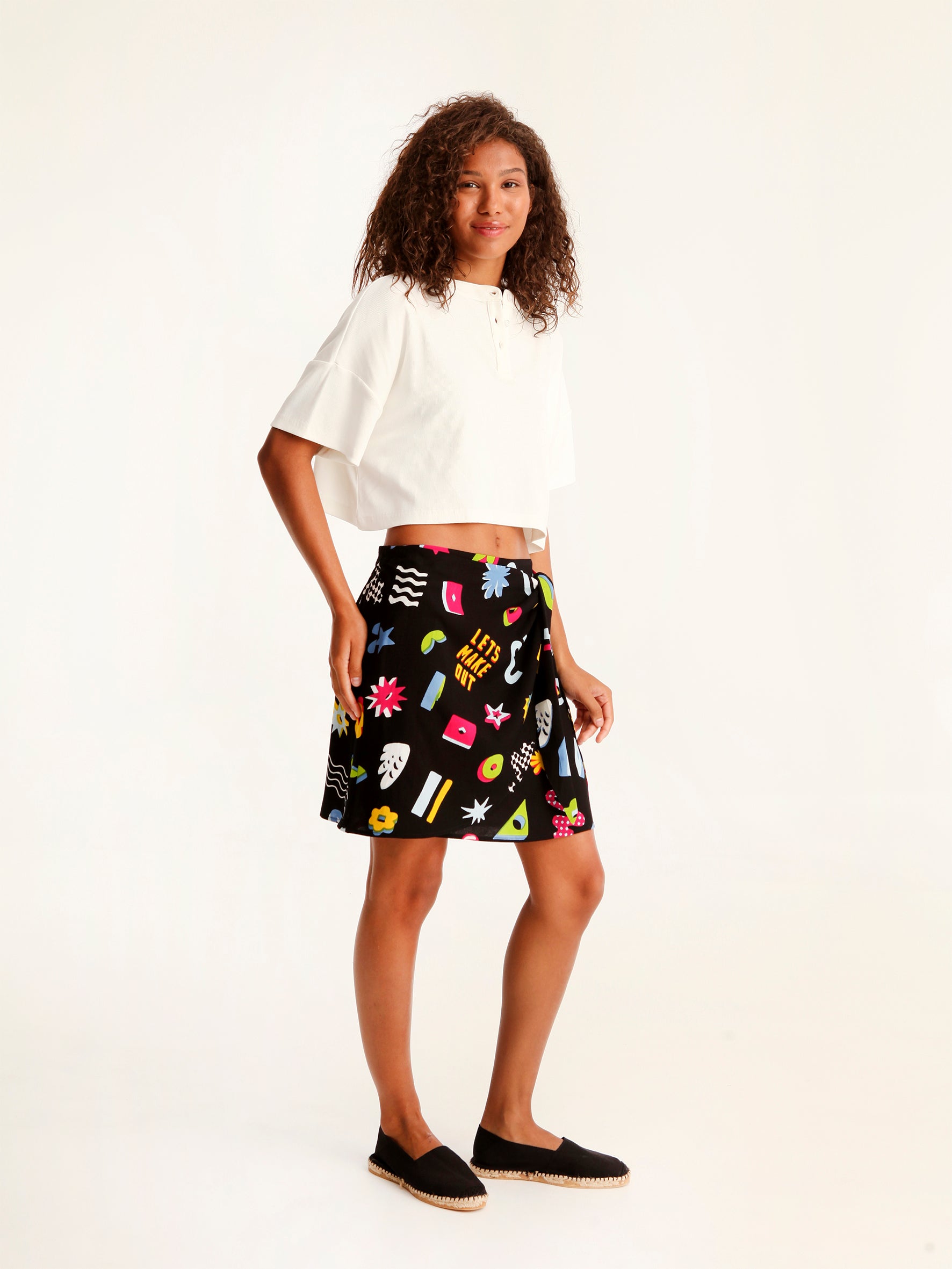 MORE AMOR mini wrap skirt