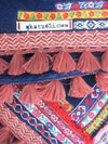 Beach towel in navy blue color with woven ribbons and tassels