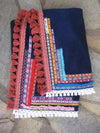 Beach towel in navy blue color with woven ribbons and tassels
