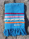 Peshtowel/towel in turquoise color with three different ribbons and a pom pom band