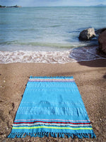Peshtowel/towel in turquoise color with three different ribbons and a pom pom band