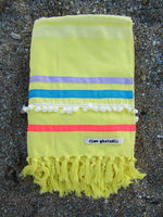 Peshtowel/towel in citron color with three different ribbons and a pom pom band