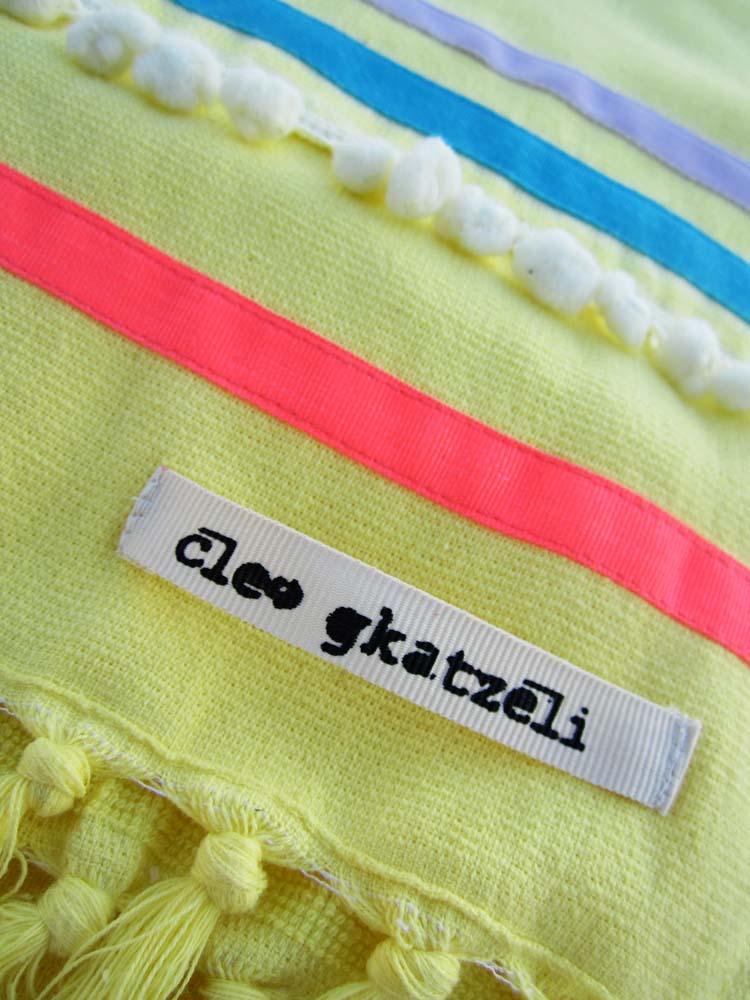Peshtowel/towel in citron color with three different ribbons and a pom pom band