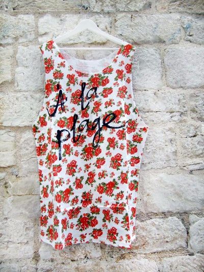 Muscle tee dress in multi floral color with a black A LA PLAGE print