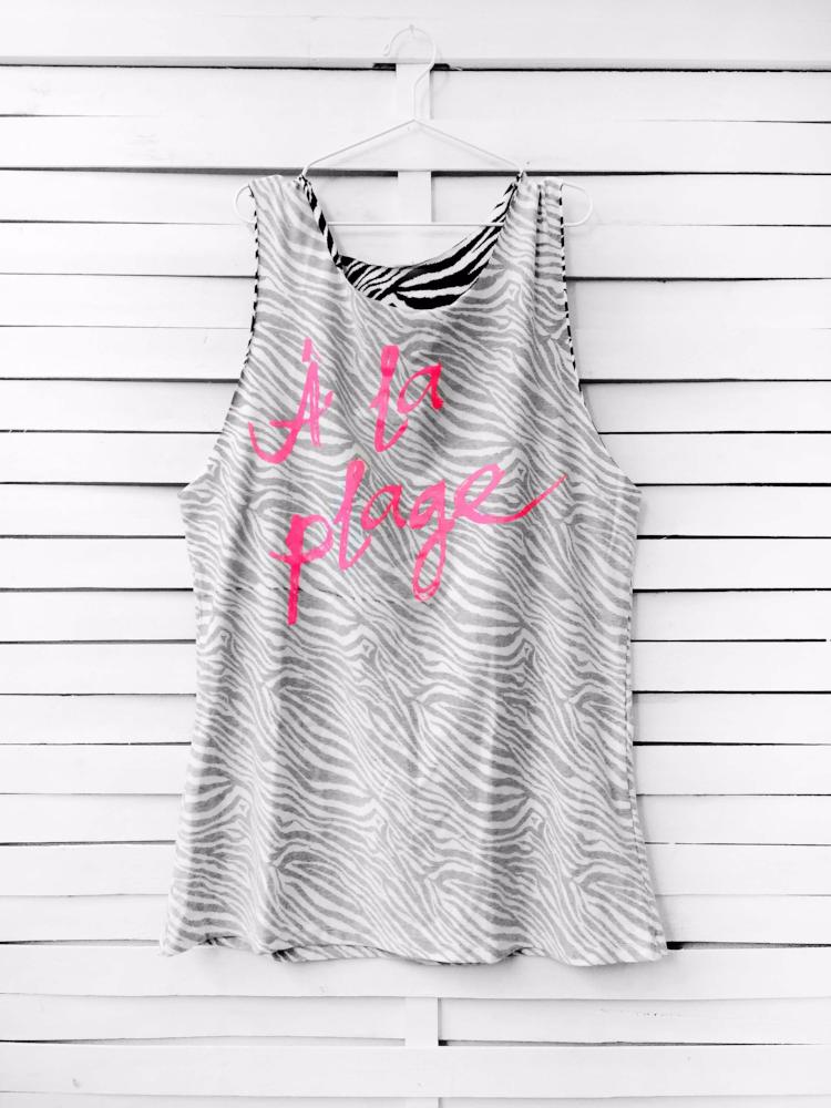 Muscle tee dress in faded zebra color with a neon fuchsia A LA PLAGE print