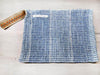 Rug clutch bag in ciel color and vertical design
