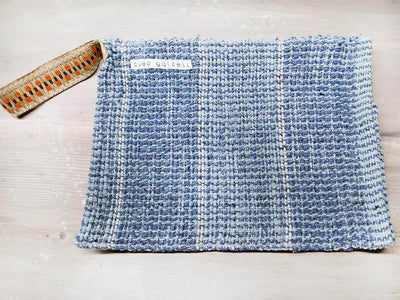Rug clutch bag in ciel color and vertical design