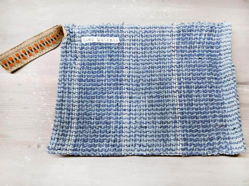 Rug clutch bag in ciel color and vertical design