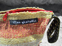 Rug clutch bag in yellow color and wide stripes