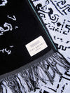 Reversible beach towel in black and white color with fringes