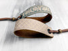 Leather bracelet with a woven ribbon and cage pattern