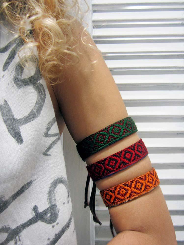 Leather bracelet with a woven ribbon and Aztec pattern