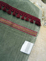 Peshtowel/towel in army stonewashed color with a woven ribbon and a fringed band