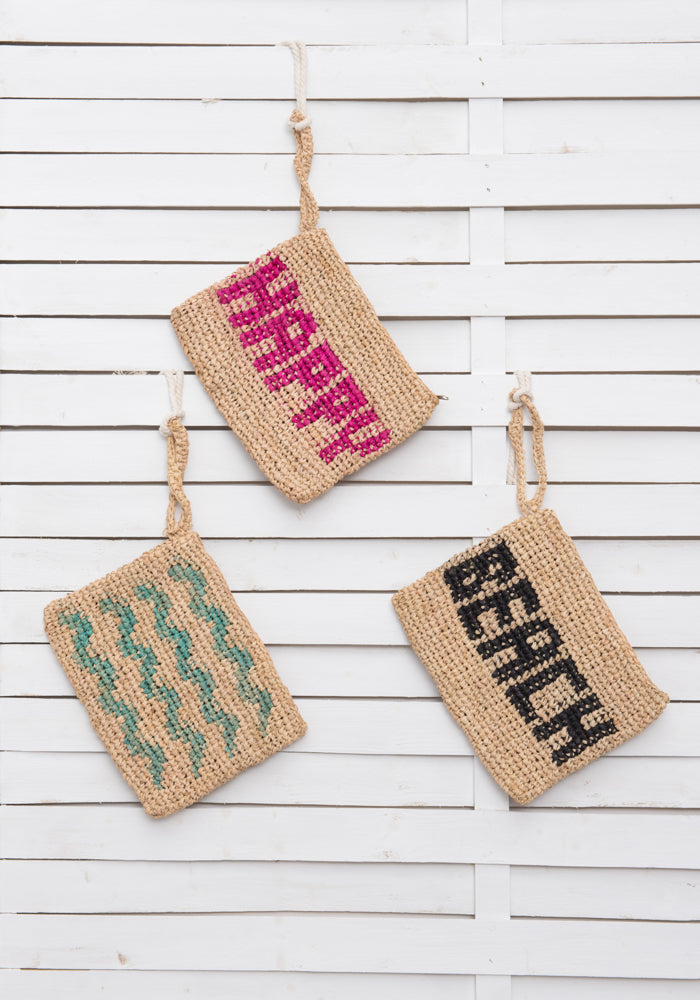 WAVES woven straw clutch