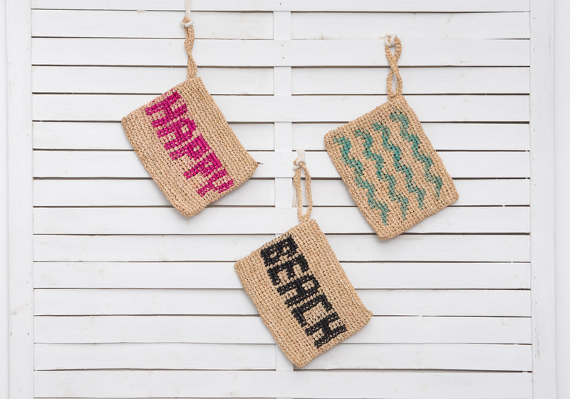 BEACH woven straw clutch