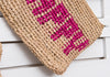 HAPPY woven straw clutch